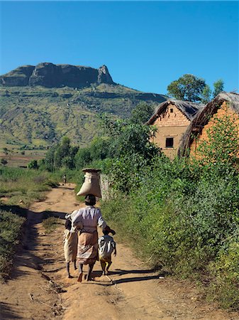 A Malagasy mother and her children walk along a track towards their home in the attractive Tsaranoro Valley,Madagascar Stock Photo - Rights-Managed, Code: 862-03364025