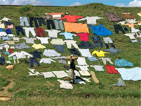 Washing put out to dry on a railway embankment near Antananarivo,capital of Madagascar. Stock Photo - Rights-Managed, Code: 862-03364060