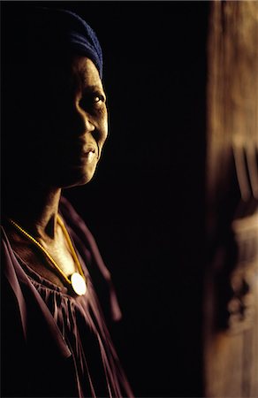 A Dogon woman stands in the doorway of a traditional adobe house in the village of Ende Stock Photo - Rights-Managed, Code: 862-03364106