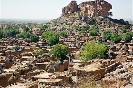 simsearch:400-05730832,k - Mali,Dogon Country. The attractive Dogon village of Songho on top of the Bandiagara escarpment. Dwellings have flat roofs while the square granaries have pitched thatched roofs. Stock Photo - Rights-Managed, Code: 862-03364177