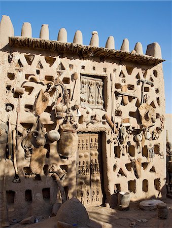 escarpment - Mali,Dogon Country. A traditional Dogon house with its walls covered with fetishes at Sangha,an attractive Dogon village built among rocks on top of the Bandiagara escarpment. Stock Photo - Rights-Managed, Code: 862-03364185