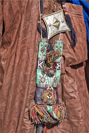 simsearch:862-03437232,k - Mali,Timbuktu. An elaborately decorated leather purse and a metal talisman box hang round the neck of a Tuareg man. Stock Photo - Rights-Managed, Code: 862-03364253