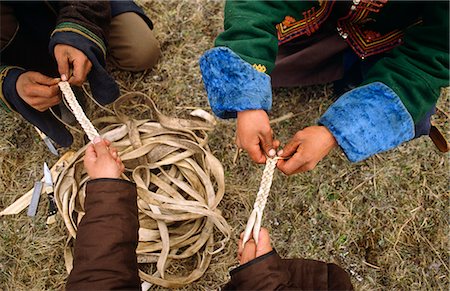 steppe - Mongolia,Khentii Province. Horse Herders on the plaiting leather straps. Stock Photo - Rights-Managed, Code: 862-03364534