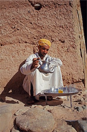 A berber man pours mint tea in an elaborate,timeless ritual. Stock Photo - Rights-Managed, Code: 862-03364561