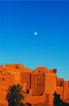 Moonrise over the castellated tower of the Taourirt Kasbah at sunset,Draa Valley,Ouazazate,Southern Morocco. Stock Photo - Rights-Managed, Code: 862-03364606