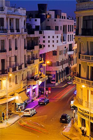 Casablanca street scene at night. In the background is the distinctive Le Triomphe cinema. Stock Photo - Rights-Managed, Code: 862-03364650