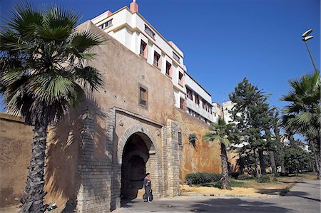 A woman emerges from one of the seven gates into the old medina in Casablanca. Stock Photo - Rights-Managed, Code: 862-03364670