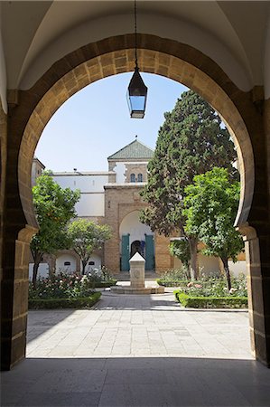 quartier habous - The courtyard of the Mahakma du Pasha in the Quartier Habous or New Medina in Casablanca. The building was once a palace and law courts but is now a police prefecture. It has over 60 rooms decorated with carved wooden ceilings,stuccos and stone floors. Stock Photo - Rights-Managed, Code: 862-03364673