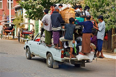 Myanmar. Burma. Nyaung U. An overloaded pick-up vehicle ferries shoppers and farmers to their distant homes from Nyaung U market. Stock Photo - Rights-Managed, Code: 862-03365099