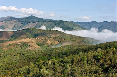 Myanmar,Burma,Kengtung. Low clouds hug the valleys of the Loi pan yawn hills which rise to 2,200 metres above sea level north of Kengtung. Stock Photo - Rights-Managed, Code: 862-03365237