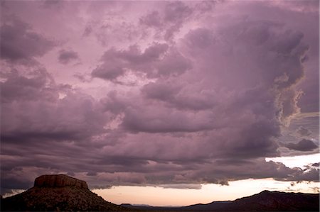 simsearch:862-03365353,k - Namibia,Damaraland. Dramatic cloud build up over the table top mountains viewed from the Vingerklip Lodge in northern Namibia. Stock Photo - Rights-Managed, Code: 862-03365341