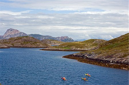 Norway,Nordland,Helgeland. A team of sea kayakers exploring Norway's coastal archipelago Stock Photo - Rights-Managed, Code: 862-03365689
