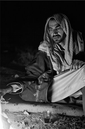 Jordan,Petra Region. A Beduin relaxing in the evening around the campfire Stock Photo - Rights-Managed, Code: 862-03365885
