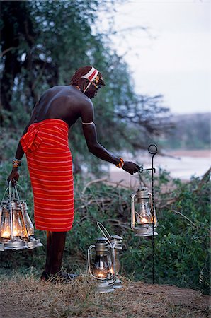 Service in the bush - kerosene lanterns light the pathway to your tent on a mobile safari. Stock Photo - Rights-Managed, Code: 862-03365960