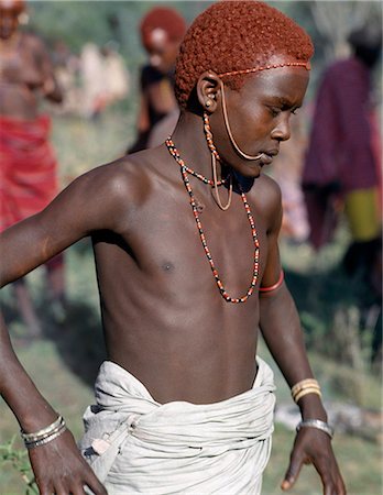 simsearch:862-03366174,k - A young Samburu warrior. In the days leading up to a circumcision ceremony,everyone becomes distinctly nervous of the conduct of the family members' undergoing the operation. Should a boy show signs of fear or cry out,he brings terrible shame to his entire family. Stock Photo - Rights-Managed, Code: 862-03366547
