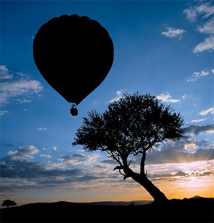 simsearch:700-06645854,k - A hot air balloon takes off in Masai Mara Game Reserve as the sun rises over distant hills. Stock Photo - Rights-Managed, Code: 862-03366595