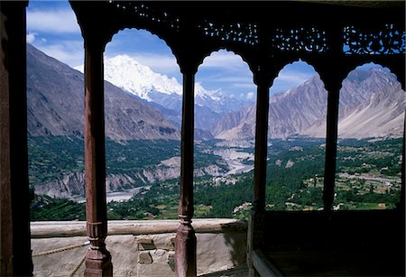 pakistan - Northwest Pakistan. The Hunza Valley facing south from the Baltit Fort along the Hunza River. The Peak of Rakaposhi in the Karakorums is visible in the distance Stock Photo - Rights-Managed, Code: 862-03360387