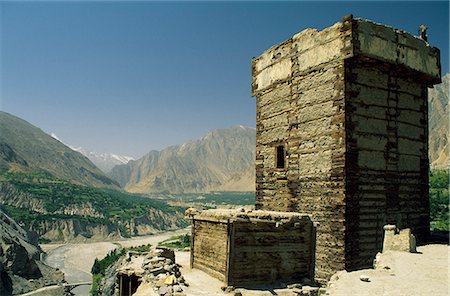 pakistan - The small Altit fort stands perched on a rock bluff overlooking the Hunza Valley on one side and Altit village on the other Stock Photo - Rights-Managed, Code: 862-03360400