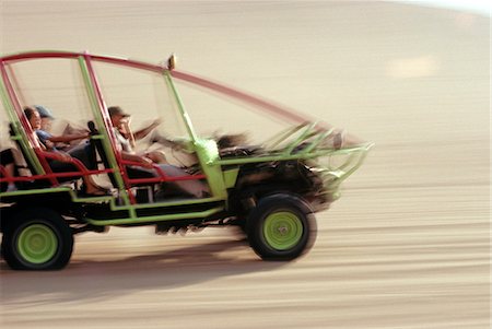 dune driving - A dune buggy speeds tourists acoss through the sand dunes near Huacachina,in southern Peru. Stock Photo - Rights-Managed, Code: 862-03360525