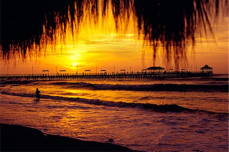 simsearch:862-03360742,k - The sun sets over the Pacific,silhouetting the jetty at Huanchaco,on the north coast of Peru Stock Photo - Rights-Managed, Code: 862-03360563