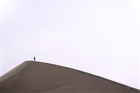 simsearch:862-03360742,k - A walker stands atop a sand dune near Huacachina,in southern Peru Stock Photo - Rights-Managed, Code: 862-03360589