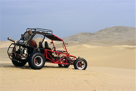 dune driving - A dune buggy sits in the desert expense of Peru's coastal desert near Ica in southern Peru Stock Photo - Rights-Managed, Code: 862-03360607