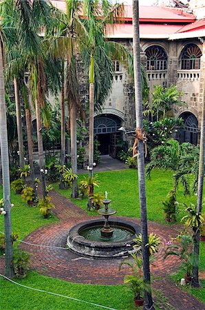 Philippines,Luzon,Manila. Intramuros - spanish colonial district - San Agustin Church (built between 1587-1606) is the oldest Church in the Philippines and is a Unesco World Heritage Site. Museum garden. Stock Photo - Rights-Managed, Code: 862-03360755