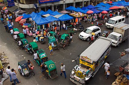 pictures of people in the market in the philippines - Philippines,Luzon,Manila. Quaipo district - a Jeepney and some tricycles at a market. Stock Photo - Rights-Managed, Code: 862-03360760