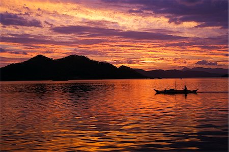 simsearch:862-03355195,k - Philippines,Palawan Province,Busuanga Island,Coron Town. Sunset over Coron Bay and fishing boat. Stock Photo - Rights-Managed, Code: 862-03360832