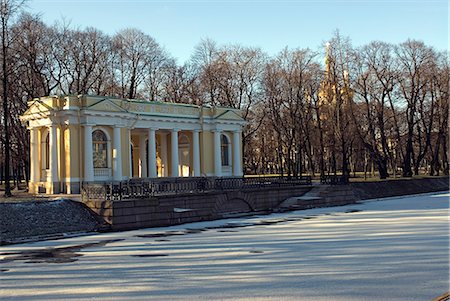 embankment - Russia,St Petersburg. The Gardens of the Michael Palace. A pavilion on the banks of the Moika canal in the gardens of the Michael Palace,now the Russian museum of art. The Church on the Spilt Blood can be seen through the trees. Stock Photo - Rights-Managed, Code: 862-03361053