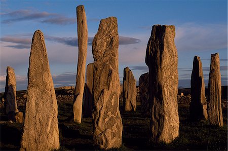 Sunset over the central circle of standing stones at Callanish. An ancient stone circle dating back to Neolithic times,Callanish is the most dramatic prehistoric site in the Hebrides and is sometimes referred to as the Stonehenge of Scotland Stock Photo - Rights-Managed, Code: 862-03361359