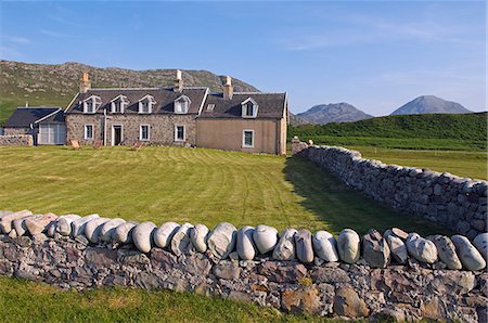 simsearch:862-03361556,k - Backed by the Paps of Jura,GlenBatrick Lodge overlooks the white sandy shore of Loch Tarbert on the west side of Jura. Beautifully isolated the lodge is only accessible by boat or a five hour walk. Stock Photo - Rights-Managed, Code: 862-03361526