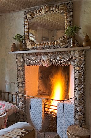 simsearch:862-03361556,k - Shell encrusted fireplace in GlenBatrick Lodge. The lodge overlooks the white sandy shore of Loch Tarbert on the west side of Jura. Beautifully isolated the lodge is only accessible by boat or a five hour walk. Stock Photo - Rights-Managed, Code: 862-03361529