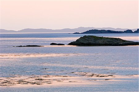 simsearch:862-03361556,k - The pink light of sunset on the calm water of Loch Tarbert on the wild west coast of Jura. Stock Photo - Rights-Managed, Code: 862-03361531