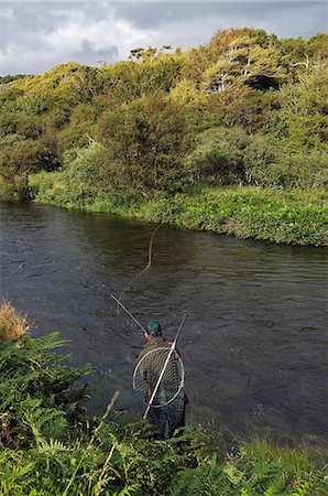 simsearch:862-03361556,k - A salmon fisherman fly fishing the Drumlaing Glide on the southern bank of the River Ba on the Benmore Estate Beat. Stock Photo - Rights-Managed, Code: 862-03361544