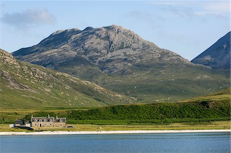 simsearch:862-03361556,k - GlenBatrick Lodge overlooks the white sandy shore of Loch Tarbert on the west side of Jura. Backed by the Paps of Jura and beautifully isolated,the lodge is only accessible by boat or a five hour walk. Stock Photo - Rights-Managed, Code: 862-03361540