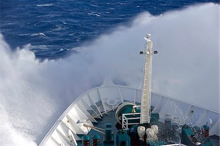 ship sailing - Antarctica,Antarctic Peninsula,Drakes Passage. Running into heavy seas,the bow of the expedition ship MV Discovery cut a path through the deep blue sea separating the southern continent from South America. Stock Photo - Rights-Managed, Code: 862-03436895