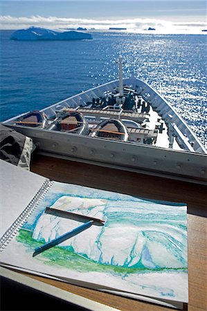 painting of the ocean - Antarctica,Antarctic Penisula. The sketch pad of Australian artist Noel Miller on the bridge of the expedition ship the MV Discovery as it makes it way down the Antarctic Sounds otherwise known as 'Iceberg Alley'. Stock Photo - Rights-Managed, Code: 862-03436893