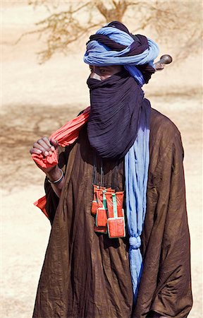 simsearch:862-03437232,k - Mali,Douentza. A Bella man wearing a turban and leather amulets. The Bella are predominantly pastoral people and were once the slaves of the Tuareg of Northern Mali. Stock Photo - Rights-Managed, Code: 862-03437227