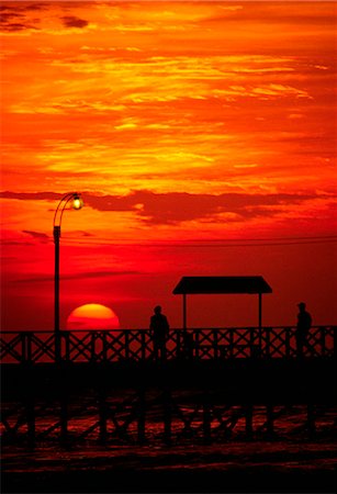 simsearch:862-03360742,k - The sun sets over the Pacific,silhouetting the jetty at Huanchaco on the north coast of Peru Stock Photo - Rights-Managed, Code: 862-03437305