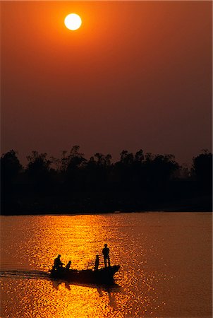 Boats crossing the Red River at Sunset Stock Photo - Rights-Managed, Code: 862-03437672