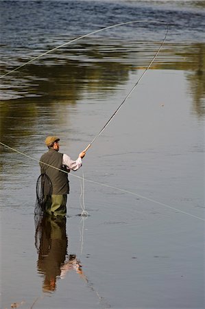 Wales; Wrexham. A salmon fisherman casting on the River Dee Stock Photo - Rights-Managed, Code: 862-03437869