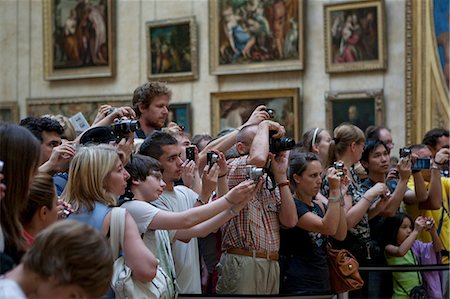 Tourists crowd around the Mona Lisa in the Louvre in Paris France Stock Photo - Rights-Managed, Code: 862-03711447