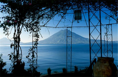 simsearch:862-07495921,k - The view across Lake Atitlan from a pergola in the gardens of Hotel Atitlan,towards San Pedro Volcano. Stock Photo - Rights-Managed, Code: 862-03711720
