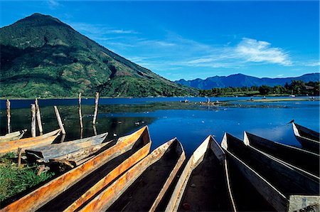 simsearch:862-07495921,k - Boats moored on the banks of Lake Atitlan and Atitlan volcano from the town of San Lucas. The Lake is Approx 15 sq Kms and parts of it reach 300meters deep. The 13 villages on the shores retain a distinctly Mayan atmosphere. Stock Photo - Rights-Managed, Code: 862-03711723