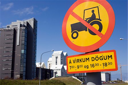 Iceland,Reykjavik. The modern buildings of the CBD constrast with the no- tractors sign on one of the town's main avenues. Stock Photo - Rights-Managed, Code: 862-03711784