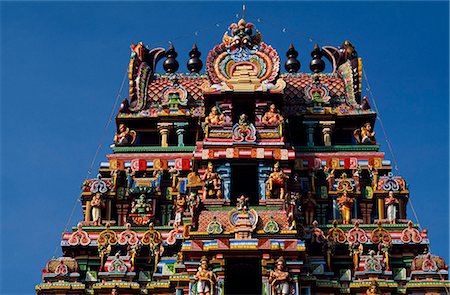 simsearch:862-03711843,k - Exuberant and colourful sculpture decorates the gopura,or gateway,of an inner courtyard of the celebrated Ranganathaswamy Temple,in Srirangam,near Tiruchirapalli Stock Photo - Rights-Managed, Code: 862-03711886