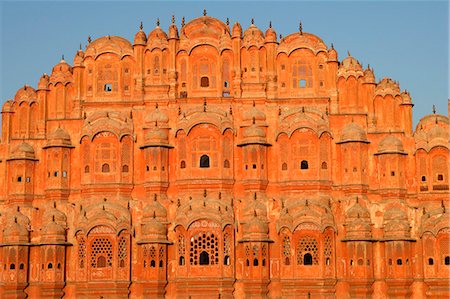 simsearch:862-03711843,k - Palace of the Wind at sunrise,Hawa Mahal was built in 1799 is an example of Rajput artistry with its pink delicately honeycombed sandstone windows of which there are 953 Stock Photo - Rights-Managed, Code: 862-03711925