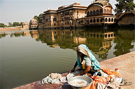 rajasthan clothes for women - Gopal Sagar Tank in front of the Gopal Bhavan complex,Deeg Palace,Bharatpur,Rajasthan. India. Stock Photo - Rights-Managed, Code: 862-03711964