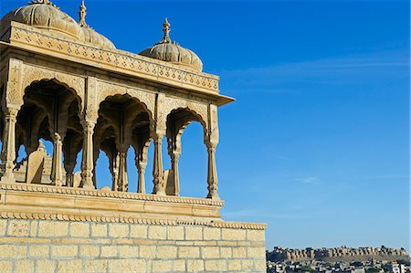 simsearch:400-05146135,k - India,Rajasthan,Jaisalmer,Bada Bagh (literally Big Garden). Built by a descendant of Jaisal and maharaja of Jaisalamer,Jai Singh II,commissioned a dam to create a water tank during his reign in the 18th C. After his death,his son Lunkaran,built a beautiful garden next to the lake and a chhatri (Hindi for cenotaph) for his father on a hill next to the lake. Stock Photo - Rights-Managed, Code: 862-03712042